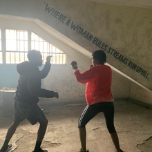 Two women boxing.