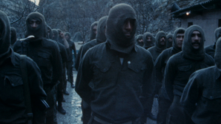 Rows of men standing in the same outfits.