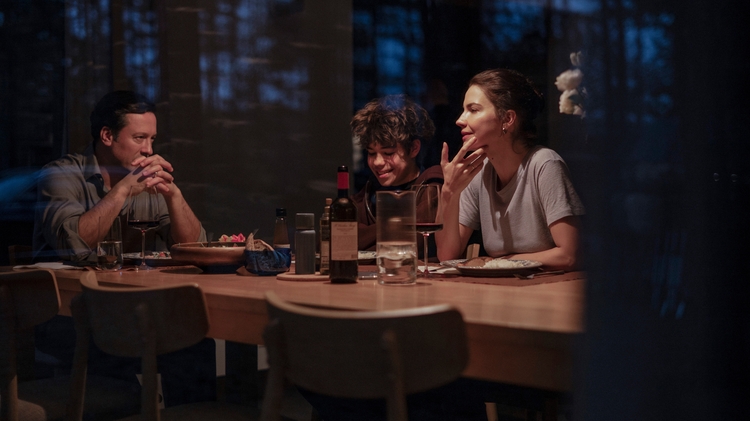 A family sitting around a table.