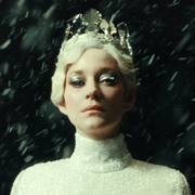 A still from the film The Ice Tower of a woman standing in the snow.