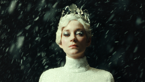 A still from the film The Ice Tower of a woman standing in the snow.