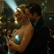 A still from the film Die My Love showing a couple dancing at a party.