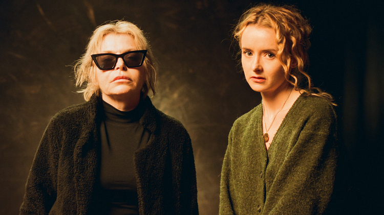 Two women (Nuala and Myrid Carten) standing next to each other looking at the camera