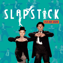 Two men in classic bowler hats and tuxedos perform a comedic pose against a vibrant teal backdrop, promoting a slapstick event.