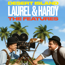 Laurel and Hardy pose with a vintage film camera on a tropical beach, surrounded by palm trees under a clear blue sky.