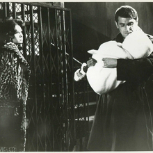 A still from the film Paris Pick-Up of a man holding a baby