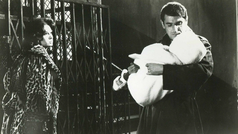 A still from the film Paris Pick-Up of a man holding a baby