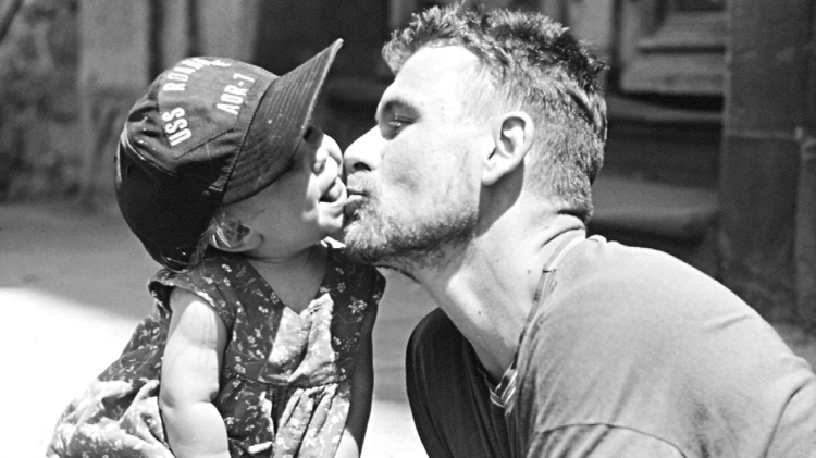 Andrew Kötting and his daughter Eden in the 1990s.