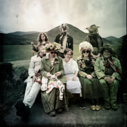 The Kotting Family all sat together in varying stages of fancy dress.