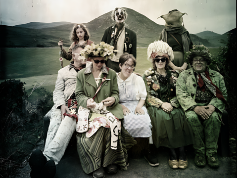 The Kotting Family all sat together in varying stages of fancy dress.