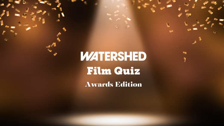 A spotlight illuminates the text "Watershed Film Quiz Awards Edition" with golden confetti in a blurred, warm-toned background.