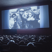 A still from Elvira Notari: Beyond Silence of people in a cinema watching a film