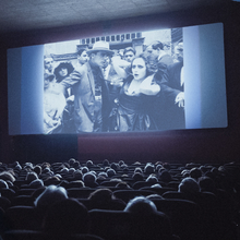 A still from Elvira Notari: Beyond Silence of people in a cinema watching a film