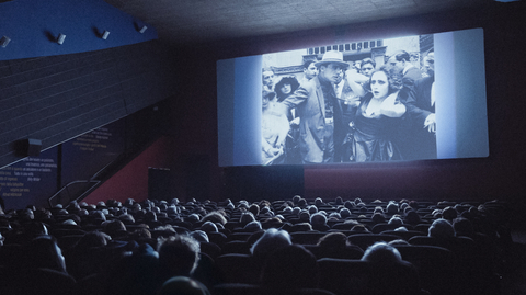 A still from Elvira Notari: Beyond Silence of people in a cinema watching a film