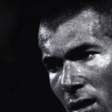 Grayscale close-up of a man's face.