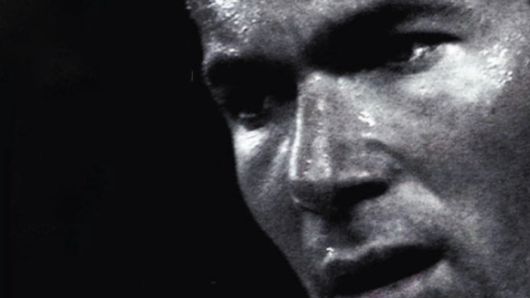 Grayscale close-up of a man's face.
