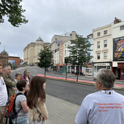 A photo of Mark Fuller leading a Cinema Walk at Cinema Rediscovered 2022.