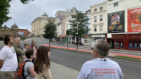 A photo of Mark Fuller leading a Cinema Walk at Cinema Rediscovered 2022.