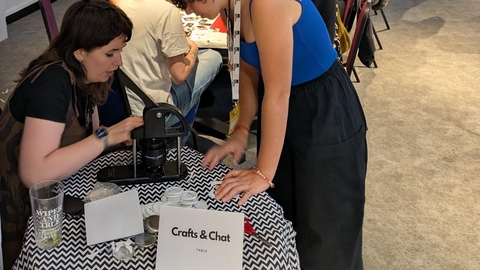 An group of people in a craft and chat session.