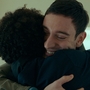 A man hugging a woman.