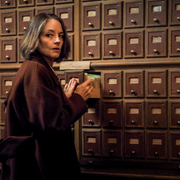 A Private Life - a woman checking files