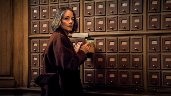 A Private Life - a woman checking files