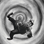 A cartoon character with a surprised expression appears to be falling into a swirling, black and gray hypnotic vortex, conveying confusion and chaos.