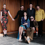 A group of people (some standing some sitting) in a room 