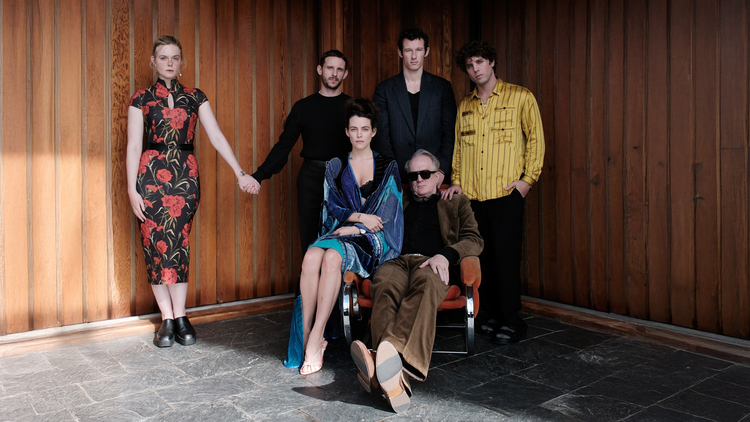 A group of people (some standing some sitting) in a room 