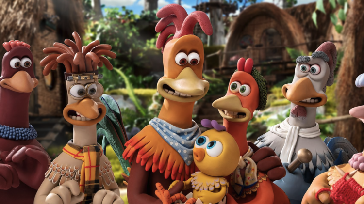 Animated chickens with expressive faces gathered outdoors in a colourful, lush village setting.