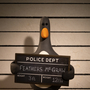 Penguin holding a police mugshot board in front of a height chart, named Feathers McGraw, 3 ft tall and weighing 12 lbs.