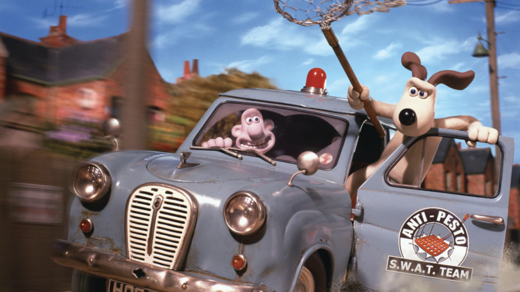 Wallace drives a blue Anti-Pesto SWAT Team car, with Gromit learning out of the front door holding a net.