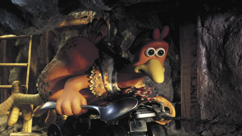 Claymation chicken character wearing a dress and hat, holding a spoon, crawling on a rope in a dimly lit cave with a wooden ladder.