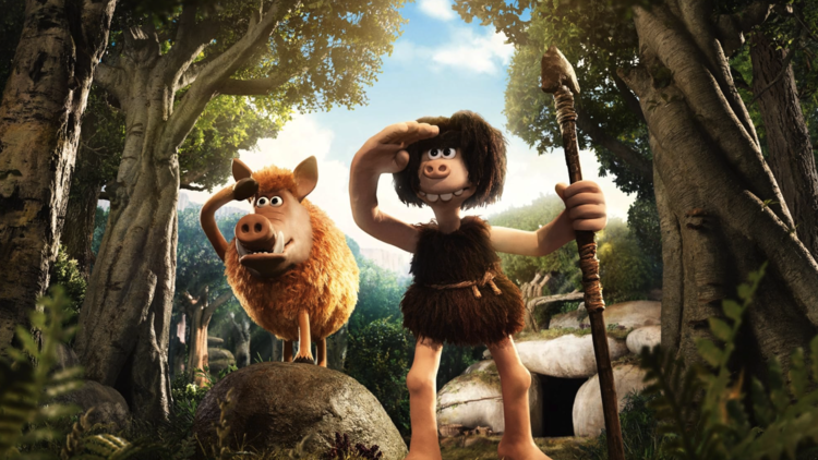 Animated caveman and boar standing in a forest, both shading their eyes and looking into the distance with stone shelter in background.