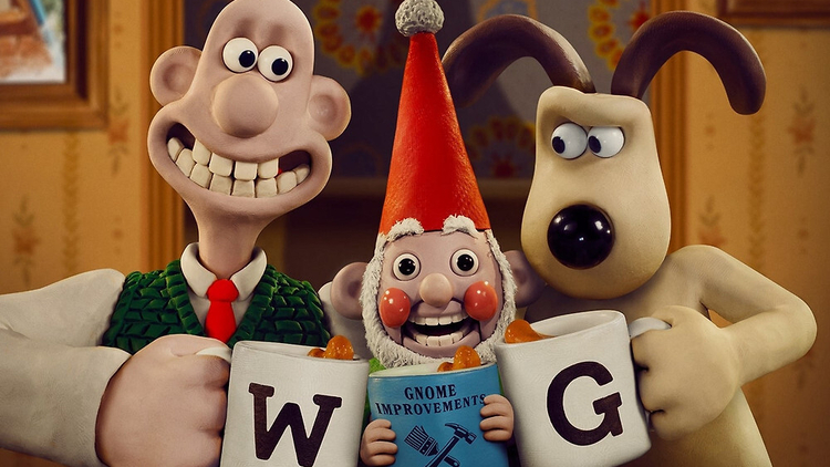 Claymation characters Wallace and Gromit cheers their mugs of tea in between a robot gnome.