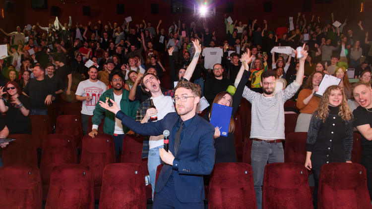 A photo of Ali Plumb hosting his film quiz in a cinema