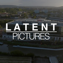 An image of a cityscape, with the LATENT PICTURES text overlaid on it. 