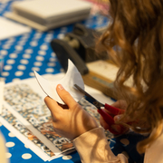 An image of a child cutting some paper