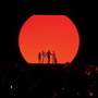Shadows of Pulp standing in front of a red circle 