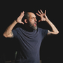 An image of the artist Jonny Cotsen mid performance. 