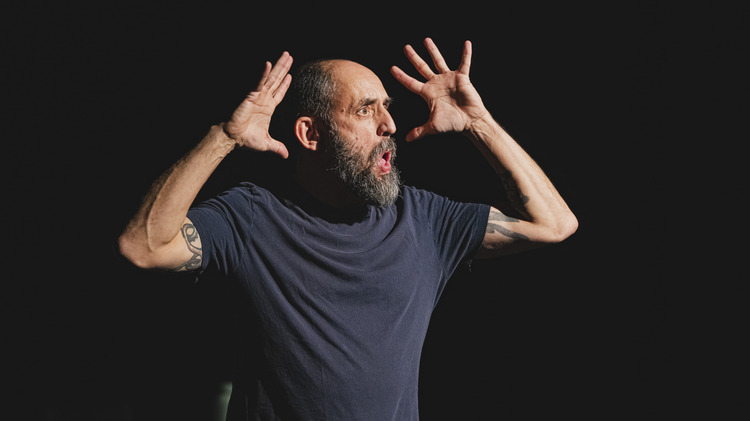 An image of the artist Jonny Cotsen mid performance. 