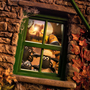 Four animated sheep characters and a dog peering through a green window set in a stone wall with autumn leaves and a spider web.