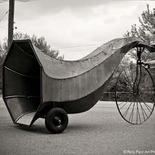 An image of Dominique Vyborna pushing a comically oversized horn on wheels.